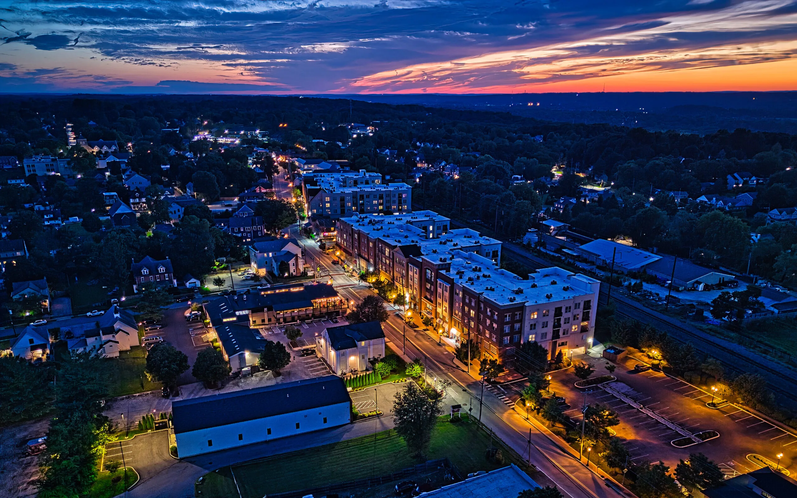Aerial view of a neighborhood at sunset.